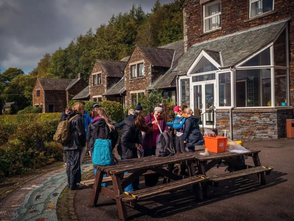 Accommodation building with a school trip group standing by entrance