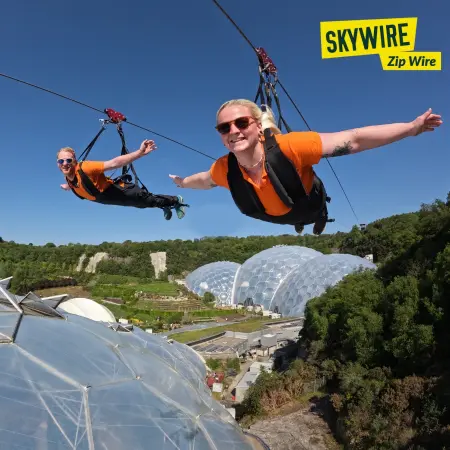 zip wire with pupils flying along outside over the top of Eden
