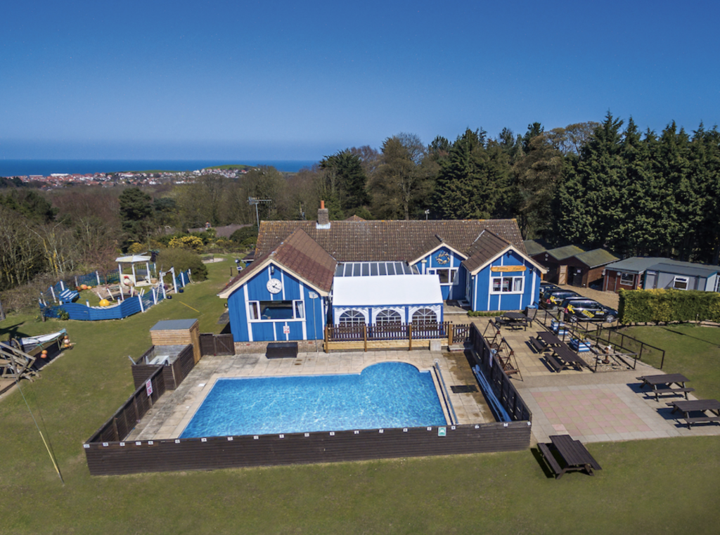 swimming pool set in a garden area