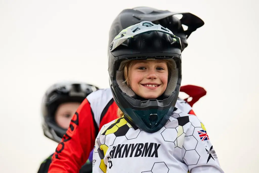 primary school pupil with BMX clothing on and helmet