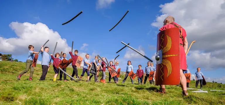 primary school group with Roman play swords and shields