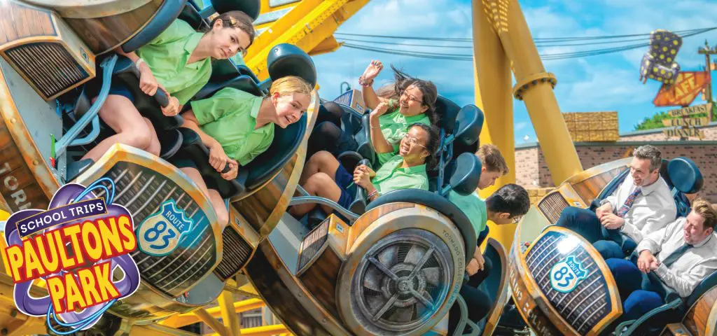 Paultons Theme Park Hampshire 1 school group including a teacher enjoying a fast moving theme park ride