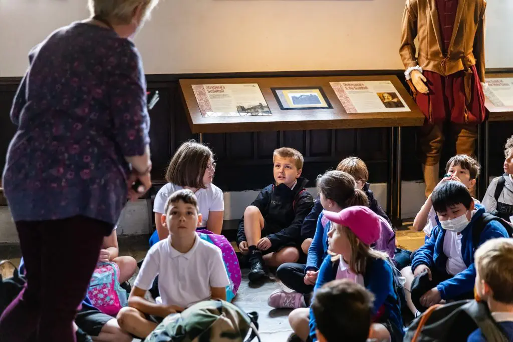 school group in a workshop presentation at Shakespeare's Schoolroom and guildhall