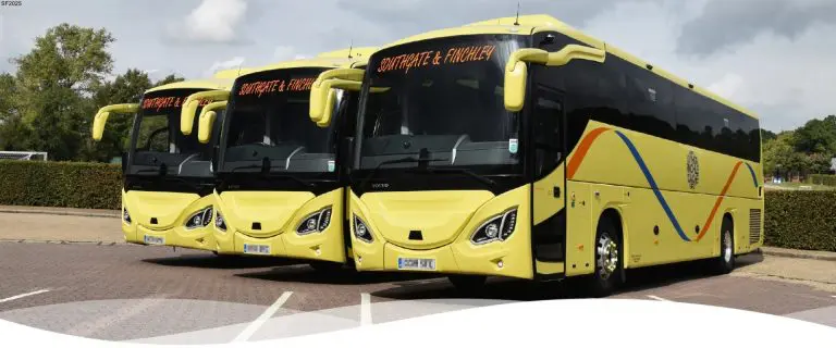 three single decker coaches in a carpark in Southgate and Finchley