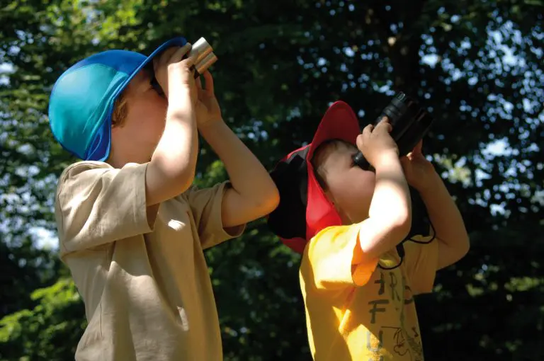pupils outside looking through binocularsmbird watching