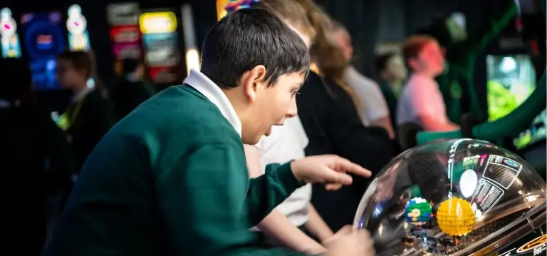 school pupil in a science room looking at exhibition activities