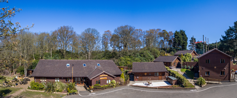 accommodation block set in the country with tress around it