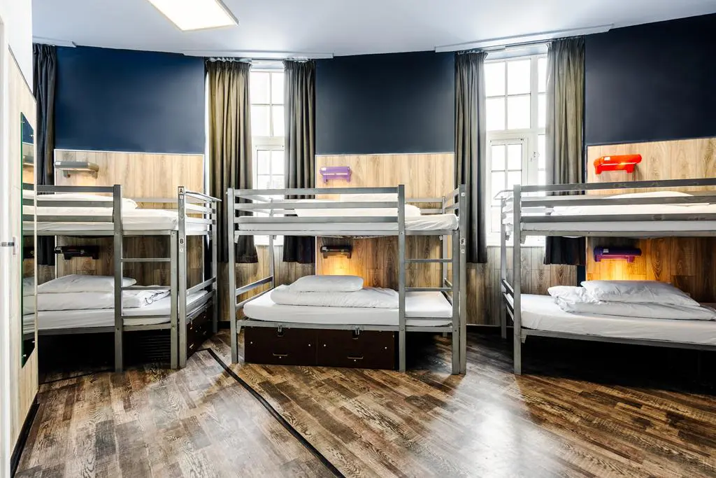 multiple bunkbeds in sleeping room