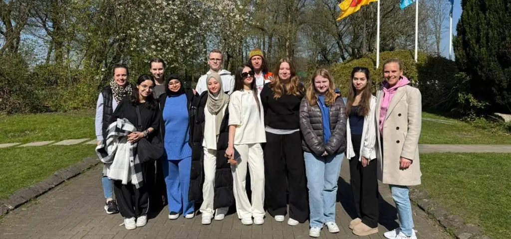 image of a group of post 16 students smiling outside at the Anderton centre