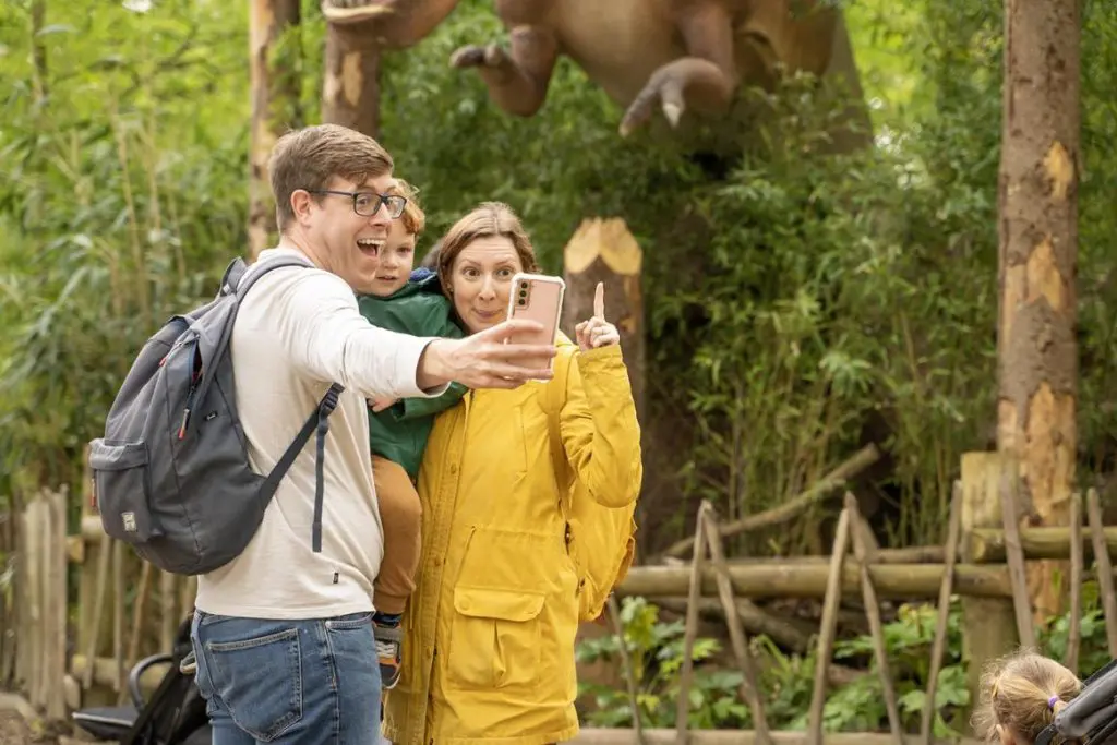 group of post 16 students taking a selfie with a mobile phone at the zoo