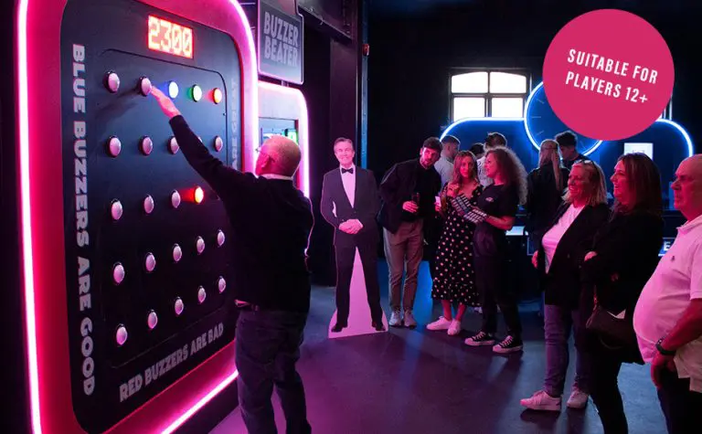 students at an indoor activity themed gameshow doing puzzles