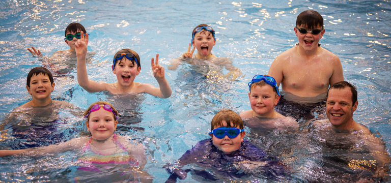 school group in swimming pool