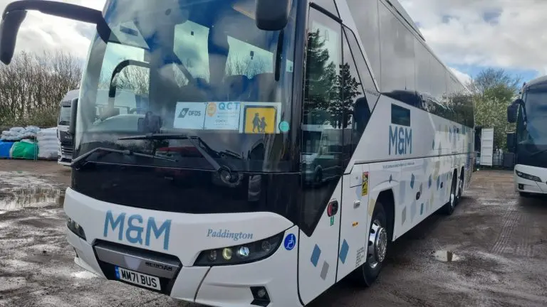 side view of a school coach in a car park