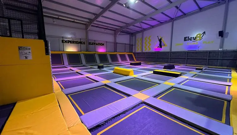 multiple indoor trampolines at a park