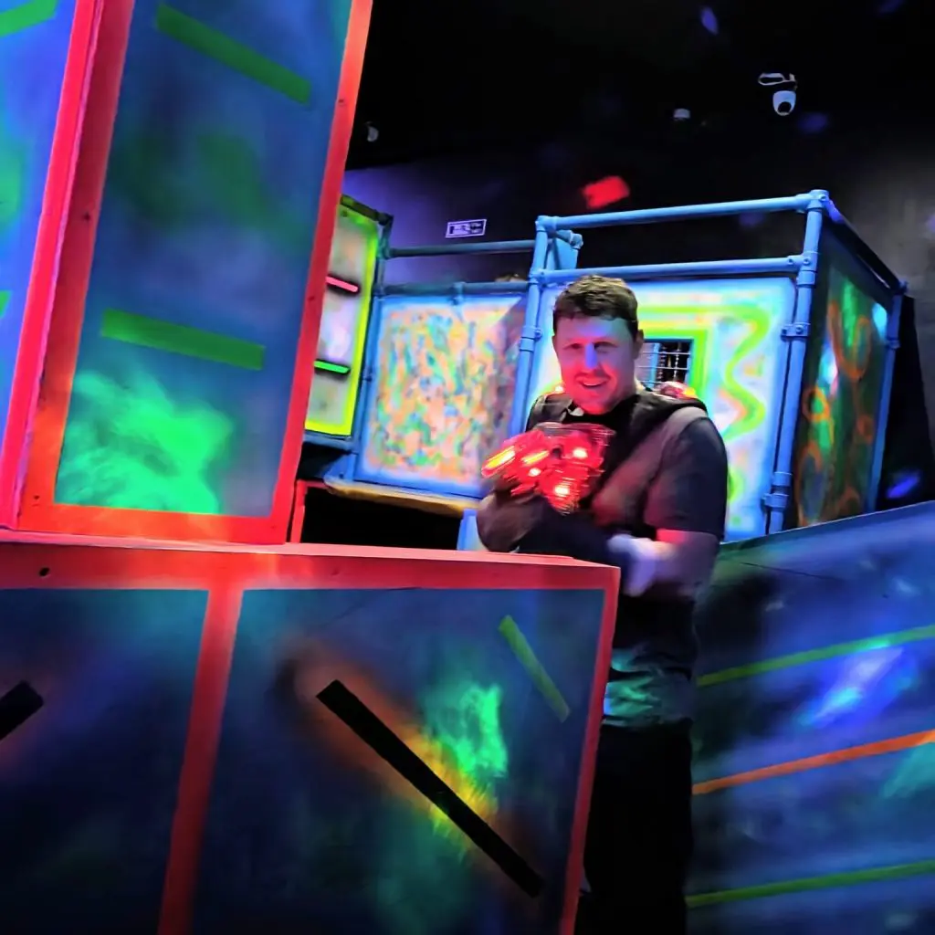 student with laser tag equipment on