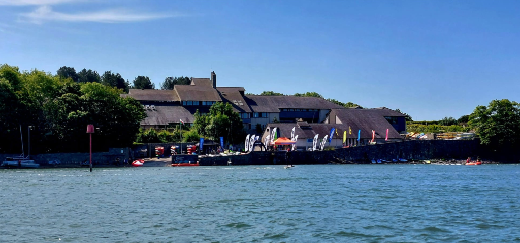 image shows Plas Menai residential activity centre on the lake