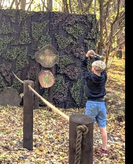image of pupil axe throwing at Adventure 4 You Outdoor Activity Centre Northamptonshire