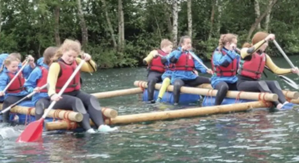 image of pupils doing water sports on rafts at Herts Young Mariners Centre