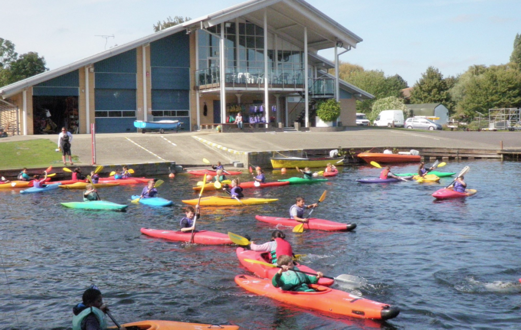 image of students doing water sports in kayaks at Herts young mariners in Hertfordshire