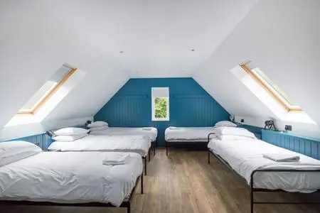 indoor bunkhouse room with 5 beds