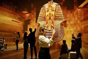 students taking photos of an exhibition of the Great Sphinx