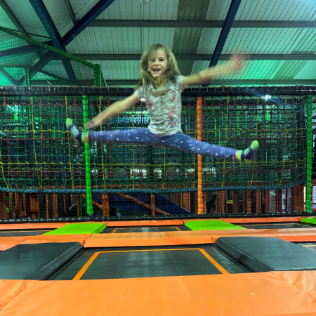 primary school pupil on an indoor trampoline