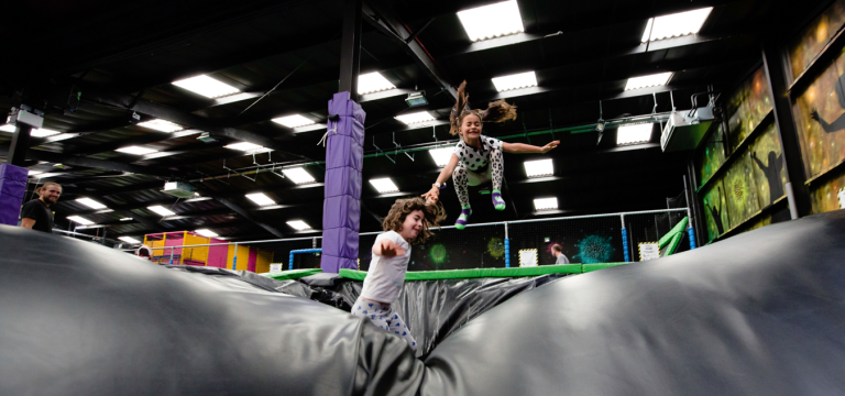 primary school children on a large inflatable bouncy ball