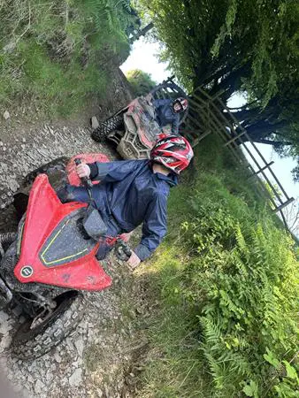 two school pupils on a dirt track quad bike trail