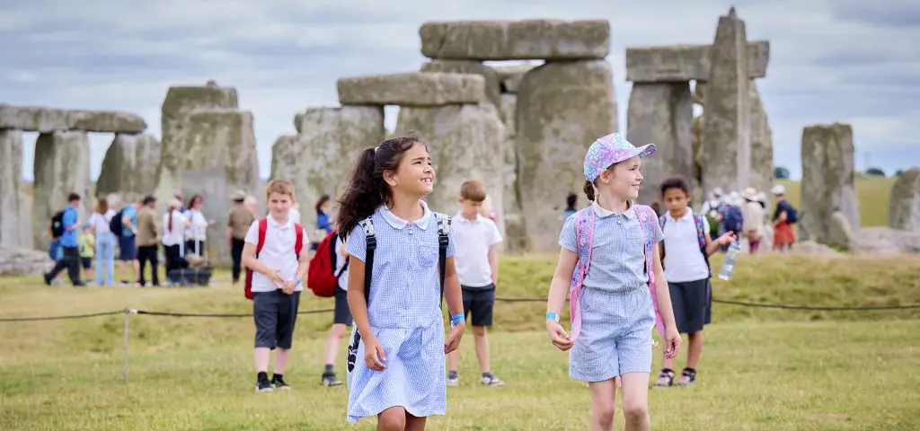 English Heritage Stonehenge 4 school group walking around Stonehenge outside