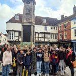 school group in a medieval street in Canterbury