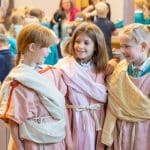 school children dressed in roman togas on school trip