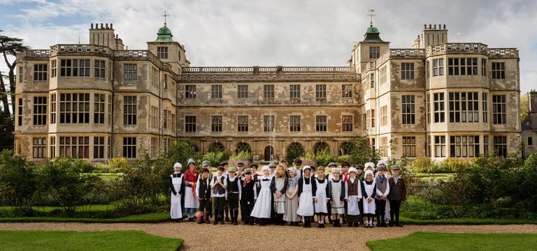 primary school group dressed as servants at a stately home