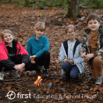 school pupils in forest doing bushcraft