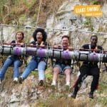 school pupils screaming on a giant swing themed ride at adventure Bluewater