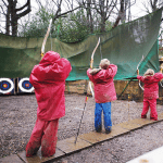 pupils on an archery course at an activity centre