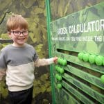 primary school pupil working a fun looking interactive farm puzzle board