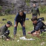 secondary school group in a field doing filed study work