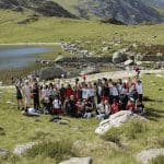school group on a school trip having a great time near a lake in the Welsh mountains