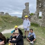 school group outside an a historical building learning about its history