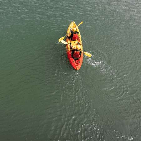 school pupils on a river in a canoe