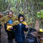 primary school group dressed up as bees in a forest