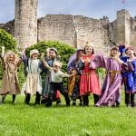 primary school group dressed up as surfs, knights and maidens at a castle in Yorkshire