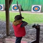 pupil outside on an archery range