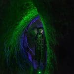 a model pirate carrying a rum keg in a tunnel