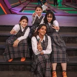 school group having a photo taken at an indoor play centre