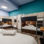 indoor bunkhouse room with beds desk and chairs