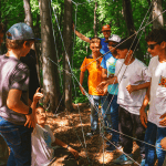 students doing problem solving task in the woods
