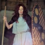 lady dressed in Celtic iron age clothing with spear and shield