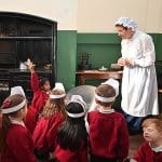 school group dressed up in museum