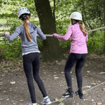 school pupils on a low ropes course challenge